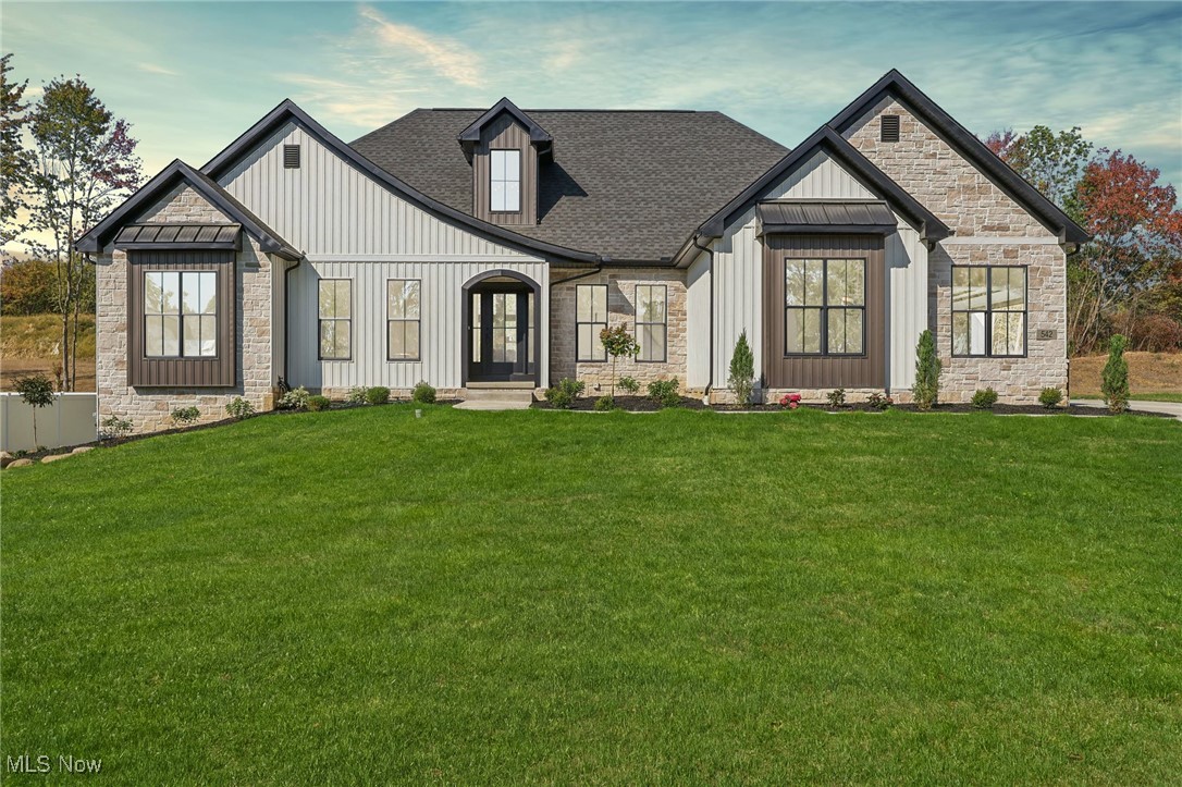 ***Open house 9/21/25 from 11-3***Available for occupancy mid October 2025. Construction is complete and can be shown by appointment! Welcome to Lakewood Estates in Canal Fulton, where Modern Home Concepts delivers energy-efficient, modern living paired with stunning architecture. This model home and other homes available to be built feature an open-concept floor plan and high-end finishes tailored to today’s lifestyle. Buy this just built new construction 4 bedroom, 2 full and 2 half bath model home with finished basement or ask about other opportunities to build in this development. Step into a spacious foyer leading to a private study or home office. The large great room opens to a covered patio, complete with a cozy stone fireplace, perfect for cooler months. The chef’s kitchen stands out with custom maple cabinetry, soft-close drawers and doors, a large center island, sleek quartz countertops, stainless steel appliances, and a generous walk-in pantry. The owner’s suite offers a luxurious retreat with an oversized tiled shower, soaking tub, dual vanities, and a spacious walk-in closet. Two additional bedrooms share a full bath with dual sinks, quartz counters, and durable LVT flooring. Convenience is key with a mudroom and laundry room conveniently located on the main level. The home also features a partially finished basement with a half bath, with the potential for a rec room, fourth bedroom, and full bath in the unfinished portion. As an Energy Star® builder, Modern Home Concepts includes energy-efficient windows, solid core doors, and quartz countertops as standard, along with a one-year builder warranty and a 20-year foundation warranty.
