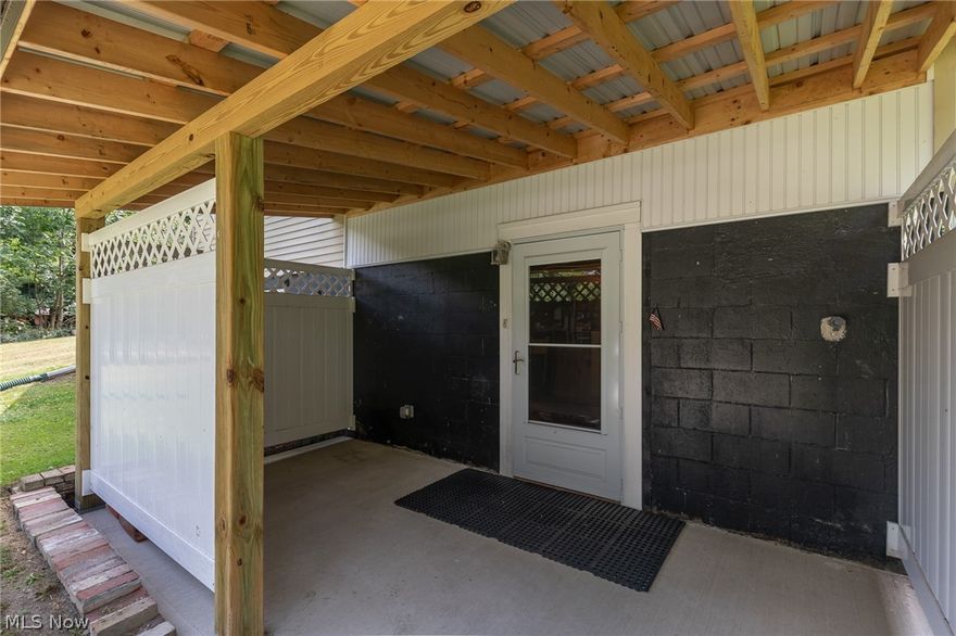 LOCATION! LOCATION! LOCATION! Don't miss this wonderful home situated on 3.68 private, beautiful, wooded acres in Berkshire School district. This home features a very cozy living room with fireplace, an eat in kitchen, three first floor bedrooms, and a full bath. The upstairs was never finished, but completed would add two additional bedrooms and another bath. The walkout basement is unfinished and has tons of space for a workshop, rec room, or storage. Outside, there is a new covered side entry as well a deck on the far side of the house which is perfect for outdoor entertaining in any weather with the Sunsetter retractable awning! The gorgeous park-like property is heavily wooded with many mature trees. Property is very close to the bike path for easy access.  Recent Updates Include: new boiler and HWT (May 2021), new glass block windows in basement (June 2022), new covered side patio entrance to basement (Sept 2022), and new water softener (June 2023).  This home has had the same owner for over 50 years and is ready for a new owner to make it home!  Being sold AS IS.