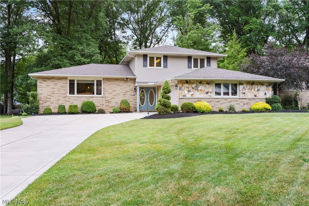 Stunning move-in ready Split level home on a cul-de-sac with 4 levels of living space. The lot and location couldn't be nicer! This home boast top rated materials, including German made wood flooring, granite countertops, 42" cabinets with under cabinet lighting, stainless steel appliances, custom made blinds for kitchen and family room, recessed lighting, glass block windows and much more. The eat-in kitchen will amaze you with a beautiful wine bar, glass backsplash, and plenty of counter space and cabinets. The kitchen island also has a stainless sink and built in microwave drawer. The kitchen peninsula offers pendant lights and additional seating for an inviting space to entertain. The formal living room is light and airy with plenty of space for stretching out. The family room has a shiplap accent wall and sliding glass doors with built in mini blinds to the beautiful outdoor living space and stamped patio. First floor bedroom, full bathroom and laundry on main level for added convenience. Reinsulated floored attic offers plenty of storage. Finished basement contains large workshop with new vinyl flooriing, built in shelving, new electrical panel and generator port.