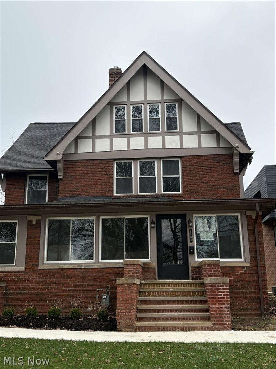 Almost complete! Welcome to the crown jewel of an exciting new Edgewater community — a stunning Tudor resurrection on one of Cleveland's most iconic streets. Part of an exciting new community of townhomes and rehabbed historic homes on one of Cleveland's most beloved streets, this masterfully restored side-by-side home delivers luxury finishes while honoring its historic character. Original hardwoods, preserved millwork, and a layout that simply doesn't exist in anything built today.
The main level features a sunroom, grand living and dining rooms, a reading parlor, rehabbed kitchen with high-end appliances, and a mudroom to contain any chaos. Upstairs, the primary suite is a true sanctuary — a massive wet room with soaking tub, walk-in shower, and natural stone tile that rivals any five-star hotel. A second spacious bedroom and full bath complete this floor. Head up to the third floor and you'll find three more generous bedrooms and another full bath — room for everyone and everything. Huge basement, back porch, and garage round it out — with lake views that never get old.
At 5 bedrooms and 3.5 baths across three floors, this home lives exactly like a single family home — without any of the hassle. The HOA covers exterior maintenance, landscaping, and snow removal, so you get all the space and character without lifting a finger on weekends. Walk to Edgewater Park and some of the West Side's best dining and nightlife right outside your door. Minutes to Downtown Cleveland and I-90. The 15-year tax abatement makes this as fiscally smart as it is beautiful. More photos to follow - estimated ready for move-in May 2026