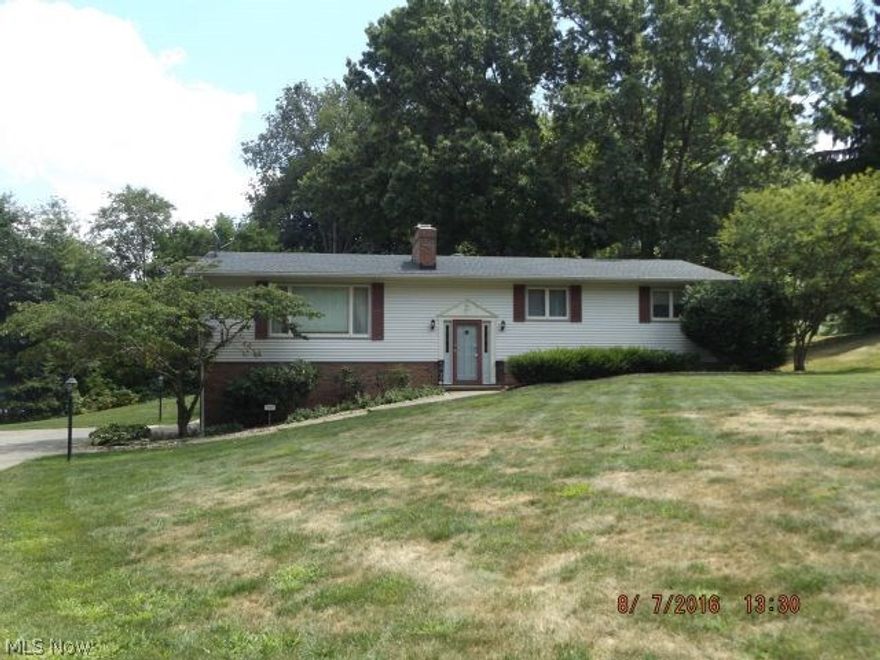 Fantastic raised ranch/bi level style home at the end of a cul-de-sac with a walkout finished lower level in Tallmadge with a large, private lot!! Main floor has a huge living room with a fireplace, three bedrooms, two full bathrooms, full appliance kitchen with eating area, a formal dining room and sliding glass doors to the 3 season room as well as the large deck which is partially covered and overlooking the very private backyard. Lower level has a huge rec room, fourth bedroom or office, laundry room and a large storage room. Has a two-car attached side load garage as well as vinyl siding, newer roof and newer mechanicals. Hardwood floors under carpet on main level. Has a quiet attic fan.  Is very clean, neutral and is in move-in condition!! Put this on your must see list as you will not be disappointed!!!