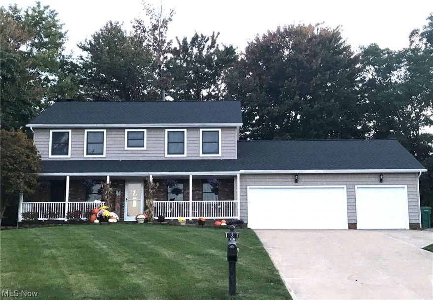 Welcome to this spacious center hall colonial, with amazing curb appeal and an inviting front porch. This home sits on the prime end of the cul-de-sac lot. Once you enter the front door you will notice unlike other colonials this gives you a spacious foyer, perfect for greeting your guests. The first floor has luxury vinyl flooring and newer carpeting. The living room is currently being used as an office with its view of the front porch. The dining room has a double door to the family room with a wood-burning fireplace and is open to the updated kitchen with quartz counters, all appliances, and room for an extra large table and bar seating. This makes it perfect for entertaining. There is a sunroom access off of the family room with great views of the private park-like backyard. Upstairs you will find 4 nice sized bedrooms, all with lots of closets even in the hallway. This home has solid wood doors, even on the closets, a partially finished basement, a 3-car garage, (extra deep 30x30) with hot cold water in garage. 16 x 12 shed with a garage door. Newer roof, siding, water tank, furnace, central air, and many other updates. This is in an area off the beaten path but close to everything.