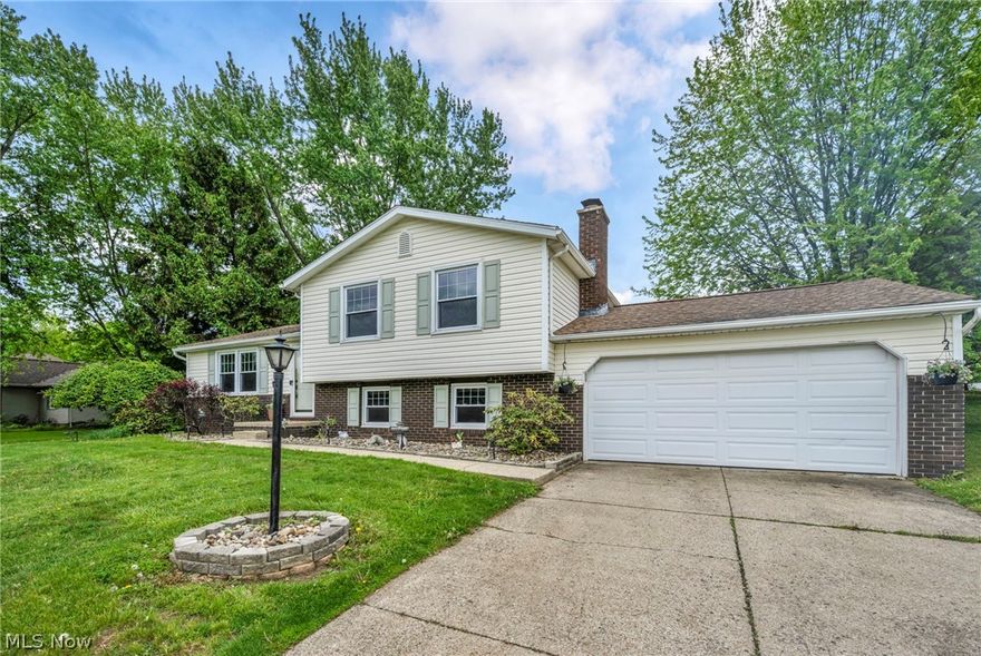 Welcome home to 1044 Tumbleweed Street NE, a GORGEOUS 3 bedroom, 2 full bath FOUR level split located in the Lake School District! When you pull in, you will instantly notice the maintenance free rock landscaping and great curb appeal this home offers. Step inside and fall in love with the abundance of natural light and luxury vinyl flooring in the spacious living room that flows into the dining space. The fully applianced kitchen features a breakfast bar, built-in wine storage and plenty of cabinet space. A slider off the back gives you access to your HUGE fully fenced-in private backyard with a playground, shed, new concrete stamped patio (2021); great for entertaining or letting the kids explore! Upstairs you will find 3 bedrooms and a full bath. Step down into the lower level and you'll find a huge, cozy family room with a fireplace, full bath and a newly redone laundry room (2020) just off the garage. Very convenient for coats, shoes and backpacks! In the waterproofed basement you will find an additional finished space; great for a home office or playroom. There is a storage/utility room in the basement as well offering great storage for holiday decor! Update include new septic 2016, new roof/siding/downspouts 2009, new water filter system and softener 2023, stamped patio 2021, new carpet in whole house 2022, new tiles in downstairs bathroom 2020, new kitchen appliances 2020-2025 and more! This home is in a lovely neighborhood offering close proximity to schools, parks, dining and shopping. Call today to schedule your private showing!