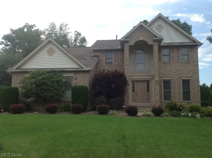 Beautiful, well-maintained, move-in ready home in desirable Ethan's Green in Twinsburg features brick front with portico, 4 BR, 2.5 bath, 2362 SF plus large finished basement with newer carpet, surround sound and extra storage room. 9' ceilings throughout, 2 story foyer, spacious 20x19 FR with 10' ceiling and fireplace.  Upgraded kitchen, first floor laundry, master bath with Whirlpool tub. Security system, deck, 2 car garage and almost half acre lot. New roof in 2011, new windows on north and south sides of home in 2013, 2 new bath skylights in 2012. This is a GEM!