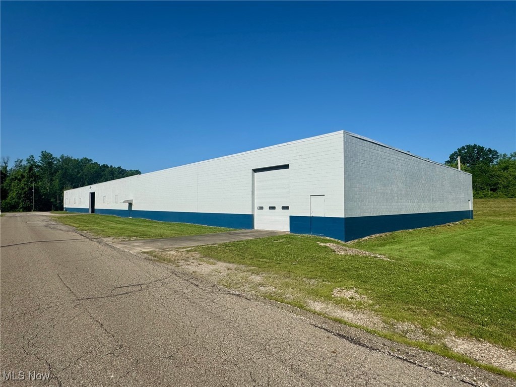 3 large warehouses totaling nearly 70,000 sq. ft with existing long-term tenant available for purchase. Excellent for the investor looking for low maintenance or the 1031 purchaser. Tenant has occupied the buildings for nearly 20 years. Property has been well maintained and very clean. 2 buildings 29,475 sq. ft each and feature 2 drive in doors and 2 loading docks. The 3rd building is 10,000 sq. ft. and features 2 loading docks. One building includes an office area, restrooms, and window A/C. Concrete is 6 inches thick, 16ft floor to ceiling height on most buildings. Landlord takes care of the mowing and major expenses; tenant takes care of other expenses. Existing rents are $12,052 monthly gross. Tenants lease is up for renewal on 12/31/25 and new rental rate has already been established for 2 of them buildings. Additional land may be negotiable.
