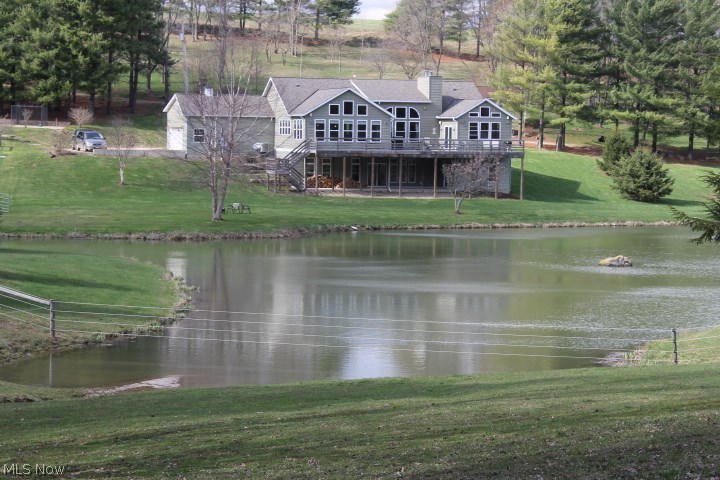Looking for an executive home with fishing, hunting and acres of rotating pastures? This quality-built 5900 sf home with 4 bedrooms and 3.5 baths is located on 32 Acres in scenic northern Knox County, Ohio, at the edge of Amish Country. Enjoy panoramic views from all the 57 windows that surround you, with views of the stocked pond, pastures and woods. The only traffic you’ll see are the abundant turkey and whitetail. These views are enjoyed from virtually every room in the house, but none as breathtaking as from the open gourmet kitchen or while dining with family and friends in the spacious dining room. Special amenities of this home include: natural gas, efficient radiant heat in all floors and garage (all zoned), low E-Glass windows, two wood fireplaces, granite counters, a huge, stainless commercial refrigerator/freezer, tons of closets, spacious bedrooms and bathrooms. Outside you’ll delight at the flowering trees, abundant hunting and fishing, 1700’ electric braided horse fenc