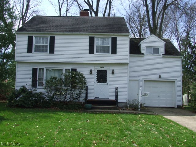 Great 4 bedroom Colonial with fireplaced living room, open to dining room, and sun room that leads to backyard. Eat-in kitchen with pantry, leads to first floor half bath and attached 1-car garage. Hardwood floors under carpet. Furnace, central A/C, and hot water tank all from 2005-2006. Glass block windows. Home Warranty. A little TLC could turn this into your dream home.