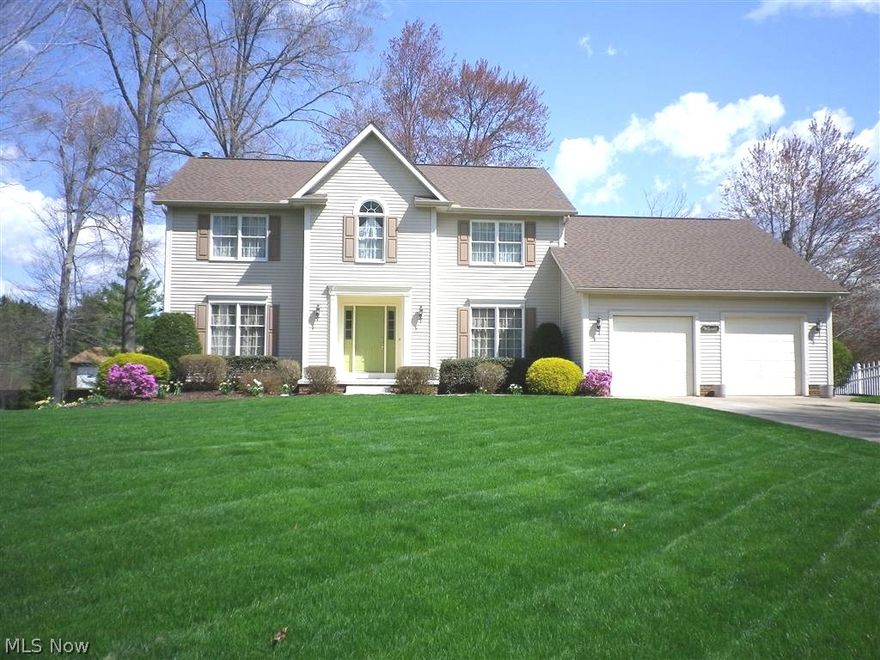 Custom built center hall colonial in Mayfair Lakes.  Foyer enter with oak parquet floors.  Formal dining room offers a trayed ceiling, oak chair railing & crown molding.  Formal living room being used as a first floor office, opens to sunken family room through French doors.  Family room features a fireplace & sliding glass doors to deck.  Open floor plan from family room through dinette & bayed kitchen.  Dinette offers a planning deck, & access through sliding glass doors, to huge deck & beautifully treed & landscaped back yard.  Loads of cabinets, a pantry, & a breakfast bar in this spacious kitchen.  Tastefully updated 1/2 bath, & a 1st floor laundry complete the first floor.  2nd floor features a master suite with cathedral ceilings, a walk-in closet & full bath suite including a jetted tub & separate shower.  Walk-out lower level boasts a 1/2 bath, a recreation room, a workshop, plus utility & storage areas.  Updates include roof, less than 2 yrs.  Furnace, A/C, hot water heater a