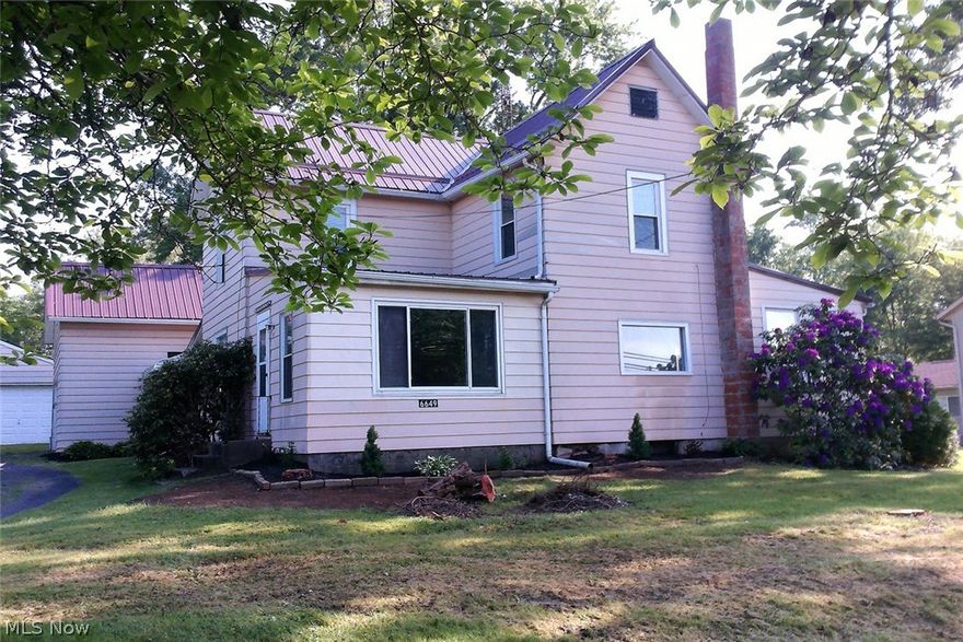 Hard to find updated 3 bedroom with a 4 car garage on 1.15 acres in Nimishillen Twp. Updates include metal roof, windows, kitchen, bath and more. First floor laundry. Sun room off of living room. Take a look at this home before it is gone!