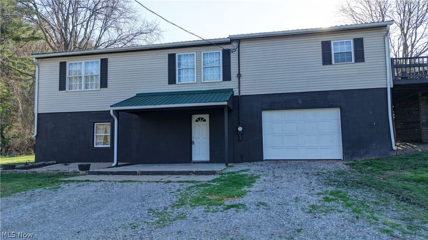 Just on the outskirts of the city, this country home has so many wonderful features.  Sitting on 1.135 acres, with a large front yard and includes a gravel play area with swing set for kids or grandkids.  The house was sided back in 2015.  The lower level includes the entry which has cedar walls and 3 large closets.  To the right of the entry way is the garage with high ceilings and the laundry.  Also in the lower level is a family room new floors and fresh paint, 2 bedrooms with new carpeted floors and fresh paint.  One of the bedrooms on the lower level could be used as an office or game room.  Walk up to the main level with so much natural light and an open concept.  The living room has new floors and fresh paint.  The dining room and kitchen have been freshly painted and new floors.  The kitchen has lots of cabinets with dishwasher, refrigerator, stove an microwave appliances.  Another 2 additional bedrooms are on the main floor with new carpet and a full bathroom.  There are French doors in the dining area that lead out to the deck.  Enjoy the sunrise or the sunset from the deck.  Well and septic have been inspected and passed (reports forthcoming).  Propane heat; electric average $200-$300/month.  Internet was Smartway $65/month.