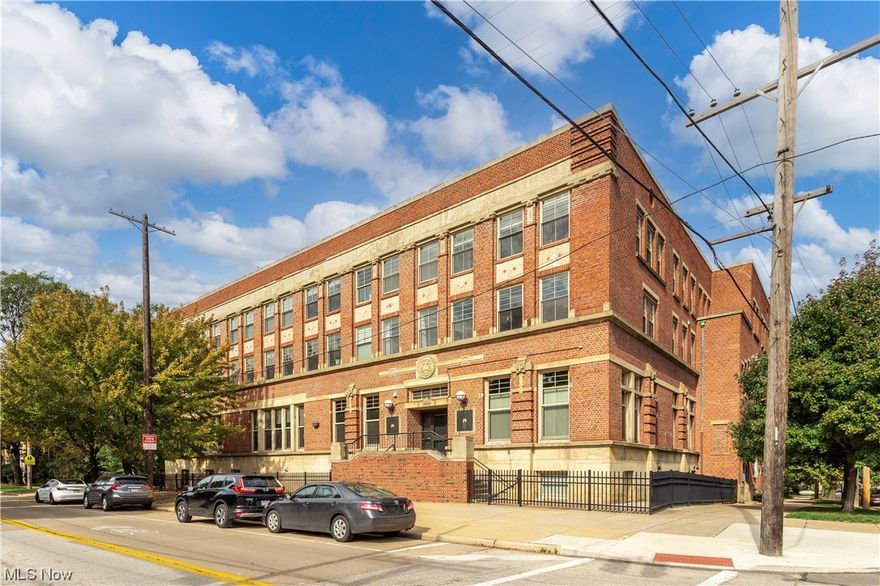 Welcome to the fantastic Franklin Loft Condominiums in Ohio City/HingeTown. This building was once the Westside YMCA building which has been thoughtfully turned into unique high end condos keeping a lot of the buildings historic integrity. The tall ceilings, bright open layout & massive windows in the living space are amazing. Benefit from one more year of a tax abatement & low maintenance living. This condo is complete w/ upscale finishes starting w/ rich hardwood floors in this open living concept condo. The main floor envelopes a loft style sun filled living room, dinning room & kitchen w/ breakfast bar, granite & stainless appliances. The lower level boasts a master suite w/ a spa type bathroom w/ an oversized shower & wonderful closets, second nice sized bedroom w/ full bath, powder room & IN SUITE LAUNDRY room. The condo unit comes w/ garage parking for one car & common amenities include a lobby in the former gymnasium - complete w/scoreboard from the YMCA days, a wonderful fitne
