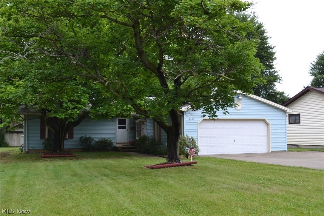 Welcome Home! This 3 BR 2 bath home is in the heart of Boardman. Large living-room with beautiful wood floors. The eat in kitchen features tons cabinets for storage and plenty of counter space for prepping. Master bedroom with private bath. Two additional bedrooms with hard wood floors , ample closet space. Full basement could easily be finished for a Rec room/ Family room. Lovely all seasons room with great views of the private back yard.