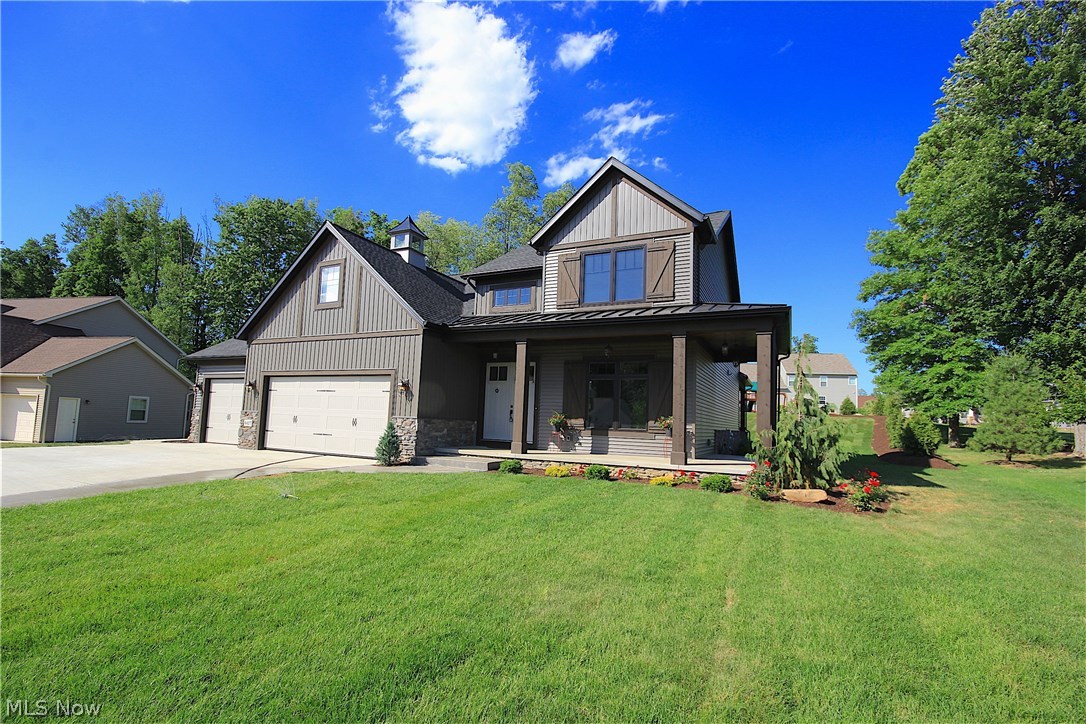Silvertree Custom Homes is proud to present our latest version of the Modern Farmhouse, the hottest design concept in current homebuilding! Available now for immediate occupancy in Kings Ridge subdivision, this 4-bedroom stunner leaves nothing to be desired. We seamlessly integrate rustic finishes with contemporary conveniences, creating casually elegant living spaces. The home spans 2,920 square feet, with a main-floor master, and three additional bedrooms on the second floor. The open-concept design boasts 3.5 baths, 10-foot ceilings on the main floor, and a 9-foot basement that has been partially finished. Custom finishes abound, including artisanal hardwood floors and custom Amish cabinetry. You'll find granite countertops in the kitchen and all bathrooms, and solid hardwood trim throughout the home. A large great room with 12' ceilings showcase a wall of windows and the charm of an wood-burning fireplace. The first-floor master suite features a custom tile shower, pedestal tub, an