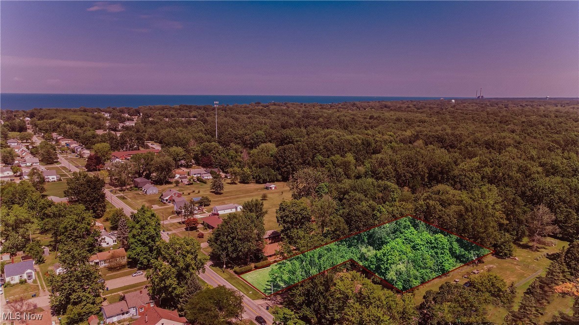 This unique offering includes three adjoining parcels being sold together, totaling approximately 3.75 acres. The front parcel (0.85 acres) is buildable and has access to public utilities at the street — making it ideal for your new home, cabin, or investment project.
The additional acreage stretches deep behind the front lot, offering a peaceful wooded setting for recreation, trails, gardening, or simply enjoying the outdoors.
Survey completed in 2021 and property lines are clearly marked. No HOA. Conveniently located near Lake Erie beaches, marinas, metroparks, and local amenities — with easy access to highways, shopping, and dining.
A rare chance to own acreage in a desirable, well-connected location.