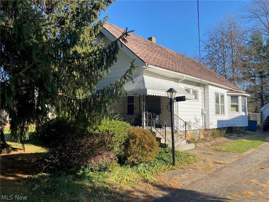 Charming Cape Cod with a huge fenced yard and near Kurtz Park. This home has a first floor master bedroom and two additional bedrooms upstairs. Original leaded glass cabinets and a window seat in the dining room. Wood floors under the carpeting. There is a bonus room off of the living room that can be used for an office or playroom. Arched doorways and natural wood work throughout. Full basement with a bar, glass block windows and 2 additional storage rooms. Hot  Water tank was installed in 2021. This home also has a newer furnace.