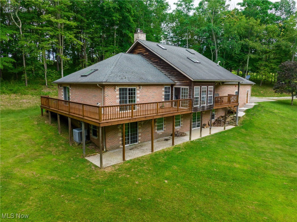 On-site auction Tuesday, September 16th at 6:00 PM. Country living at its finest, an amazing 5 BR, 4.5 Bathroom home that could be your dream home. Located just a few miles south and east of Newcomerstown, this home features a large walk-in kitchen, dining room along with a master bedroom and an attached patio with access from the bedroom. A nice sunroom is perfect for that morning coffee. Upstairs there are several bedrooms and a full bathroom. Downstairs you will find a kitchen, A large family entertainment room area, 2 bedrooms and a bathroom along with a large fireplace.  Here you have a walk out basement leading to a nice porch and into the backyard.  This property has propane forced air heat and central air. A nice 2 car attached garage leads into the kitchen area. Outside you have a garage/ horse barn with electric. Whether you're looking for a peaceful country retreat, a family home, or a investment opportunity as an Airbnb, this property offers a blend of comfort, charm, and versatility—ready for whatever you have in mind.