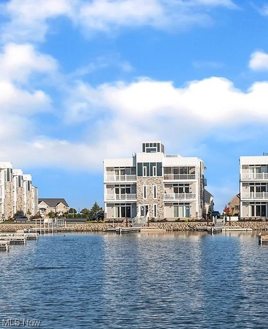 This waterfront condo home sits right on the marina with your 40' dock slip directly off of your front patio. You have relaxing views of water from left to right with sunsets straight ahead. Even better there is a retractable sunshade on your patio for those extra sunny days during the summertime. Your home is positioned on the corner with some of the best rooftop patio views in the development, Marblehead Estates & Yacht Club. Parking is right outside your back patio. The clubhouse, pool, and beach are in sight and some outdoor gas grills are just a few feet away.