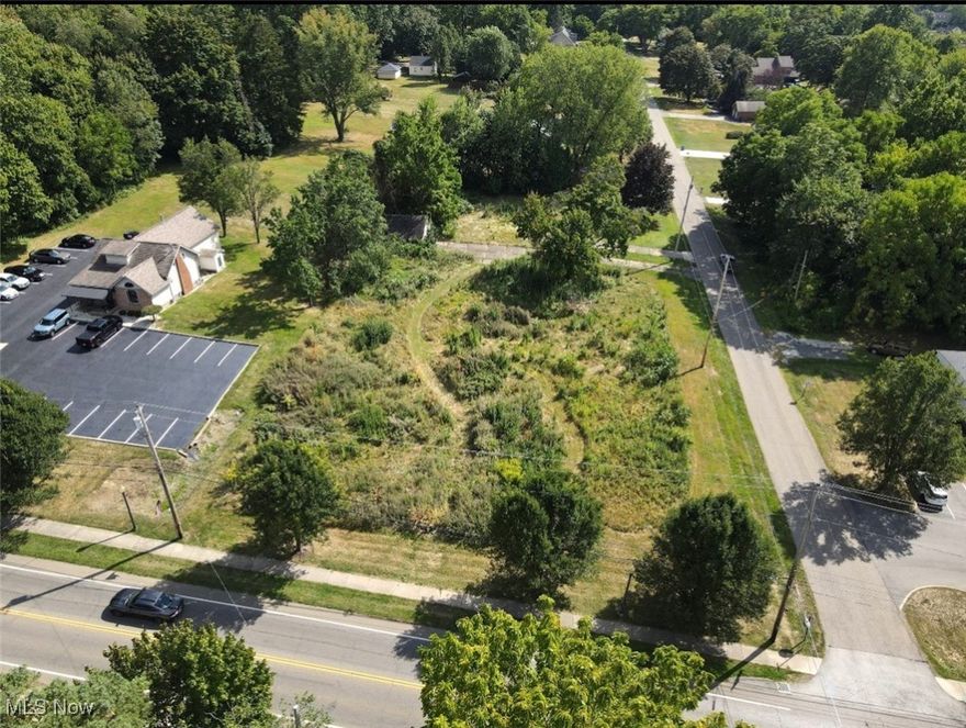 PERFECT COMMERCIAL LOT SITUATED IN THE HEART OF HOWLAND! Situated on a popular CORNER LOT with access from both roads. This lot is ready for your New Building or Plaza! Location! Location! Location! This Location is ready to be developed!