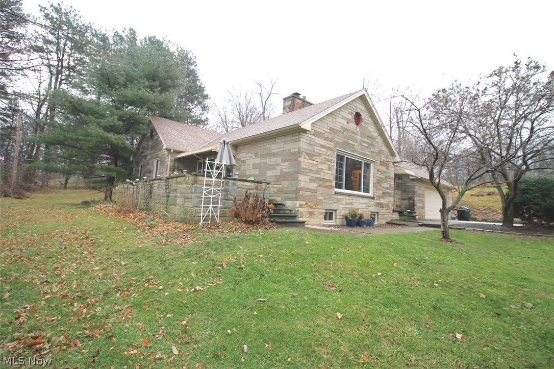 Extremely well built, beautiful Ranch style home with upstairs living suite. This wonderful home offers four bedrooms with two and a half baths situated on 3.57 Acres. Nice flow to the living area, generous size entrance with lots of storage for coats and all the extras you have when you walk in the door. Nice, cozy fireplace in the spacious living room to enjoy those winter days and nights. The dining room flows right off the living room and into the kitchen where you will find lots of cabinets for storage and countertops for meal prepping. Great for entertaining guests during the holidays or anytime. You will find modern lighting throughout the home, all windows replaced in 2013, wood under all the flooring as well. The first floor is plumbed underneath for laundry for your convenience. There are three generous sized bedrooms on the main floor and one bedroom in the upstairs suite where there is plenty of storage. Huge partially finished basement with glass block windows and