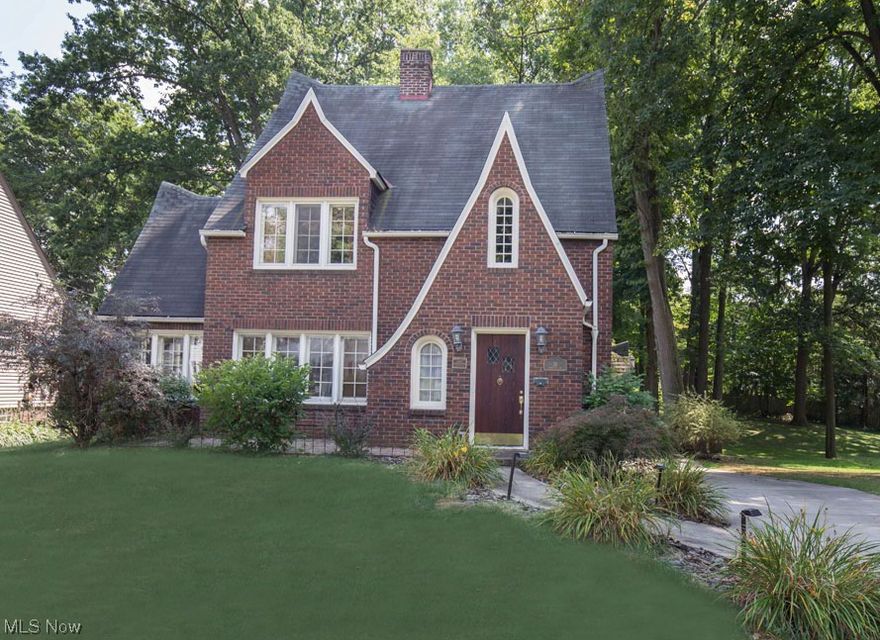 Absolutely Adorable 3-4 Bedroom Brick Tudor home in the Historic of "The Glen." Large Living Room with fireplace, sun room. Kitchen has stainless steel appliances, ceramic tile flooring, 2nd floor - 3 Bedrooms, full bath. 3rd floor could be used as a 4th bedroom, office or bonus room. Home sits on a 100ft frontage double lot. Comes with a home warranty!