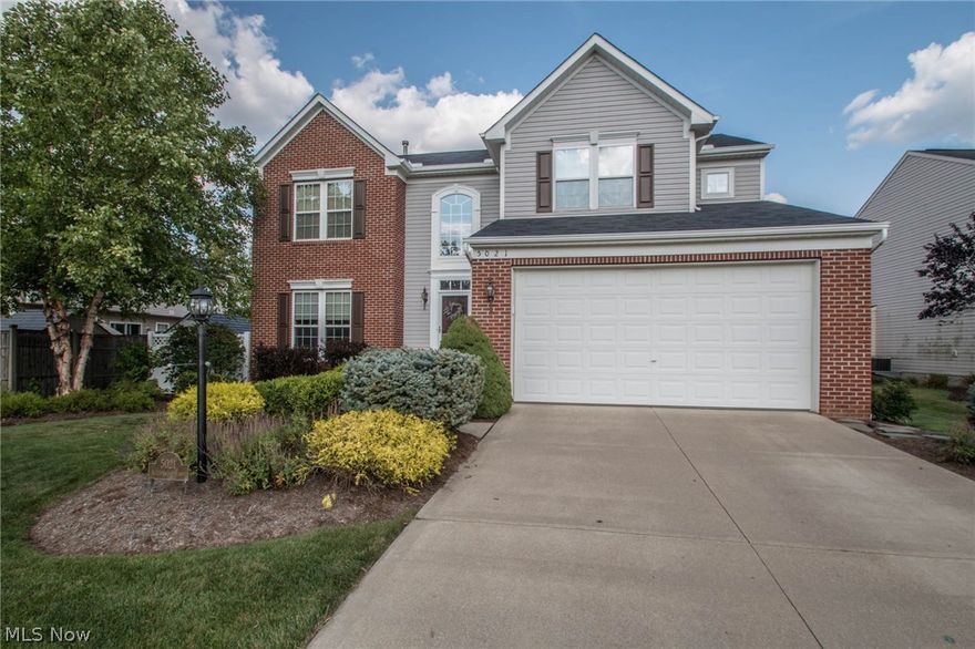 Welcome to this meticulously maintained like new colonial! Home offers all the space you need and then some! Step inside to find a two story foyer and beautiful laminate flooring flowing into the kitchen! Kitchen has been updated with granite counters, tile back splash and all high end stainless steel appliances! Breakfast bar opens to vaulted sunroom with a wall of windows allowing plenty of natural light! Open concept opens to expansive great room with stone fireplace and transom windows! Formal dining area, half bath and convenient first floor launder finish off the first floor. Second level features large master bedroom with vaulted sitting area and walk in closet! Master bath offers dual vanity sink and large linen closet. Three additional bedrooms offer large closets, one even has a wallk-in, and all have ceiling fans! Finished lower level has an additional full bath perfect for additional living space, workout area or theater room! Don't miss the back yard with maintenance free