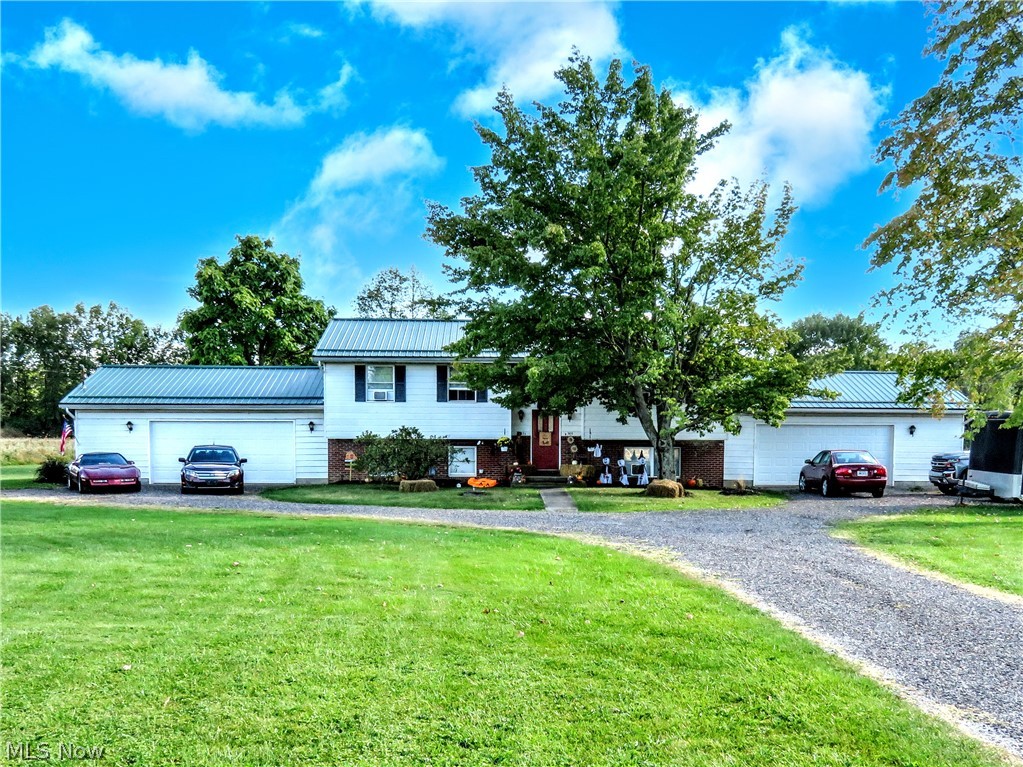 Updated Duplex sitting on a 5 acre lot in Champion. Each have 2 beds and one bath and 2.5 car garages on both sides. Upper level has laundry room and deck overlooking the back yard. Both units have updated flooring throughout and updated bathrooms. Metal roof only 4 years old. New furnace and hot water tank. The property could also be easily converted to a single family home.