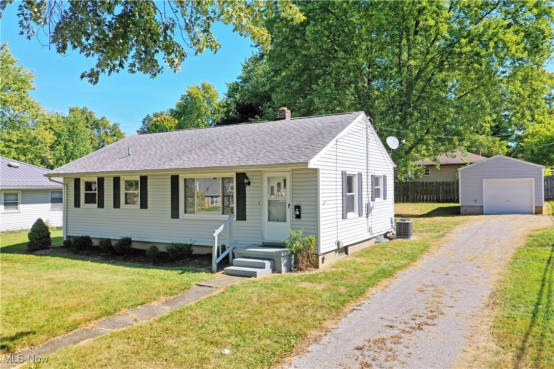 Picture perfect and waiting for you, this darling three-bedroom Cortland ranch has all the right moves and more! Offering up both its desirable location close to downtown attractions and clean, move-in-ready living space; the endearing residence is just a moving truck away from you enjoying the park-like backyard and its sizeable rear patio. The prominent corner lot quickly shows off the great looks and tidy landscaping while the long running driveway bridges both the main road and side street for easy access. A detached one and a half car garage resides beneath the trees for vehicle and equipment storage. Through the front door, a sun-washed living room takes advantage of its large picture windows to illuminate the warm, hard wood flooring that continues throughout. Just past the partitioned entryway, a scenic dining room awaits the ample kitchen with its colorful countertops and tiled floors. Further down the main hall, a brightly tiled full bath accompanies the trio of inviting bedrooms, each with plenty of closet space and tasteful wood trim work. Laundry and additional bath provisions can be found in the full basement below.