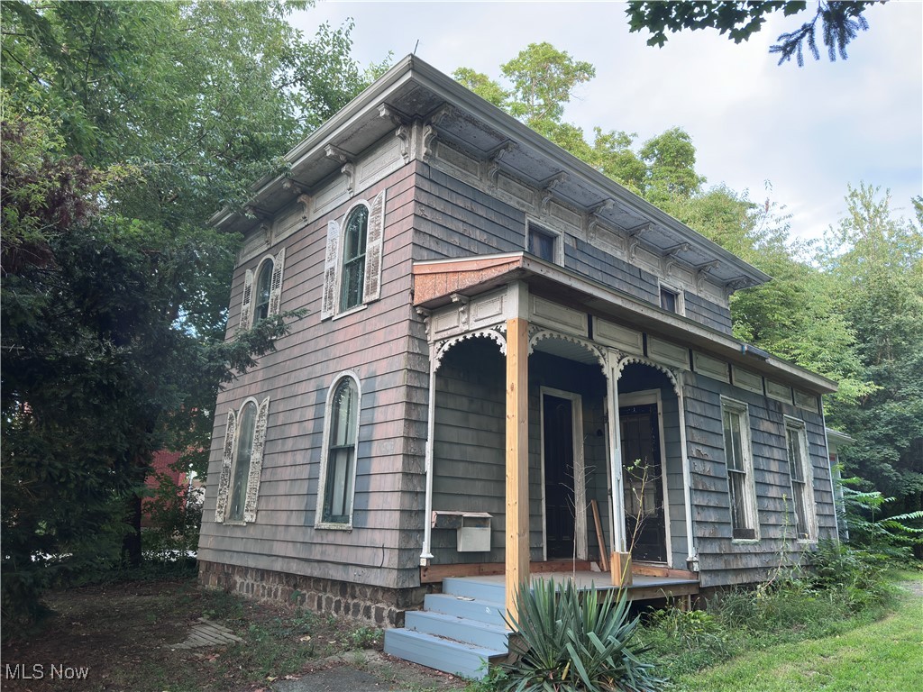 Here is your project home just in time for Fall/Winter fixing. Really cool old Victorian that has been gutted to the studs and renovation begun. There is so much potential here right in the heart of Geneva, Ohio. Live here or renovate for AirBnB , etc. The yard is deep and private. Walk back to the fire pit area and feel like you are removed from the outside world. You just have to come and see for yourself all of the potential this property holds.