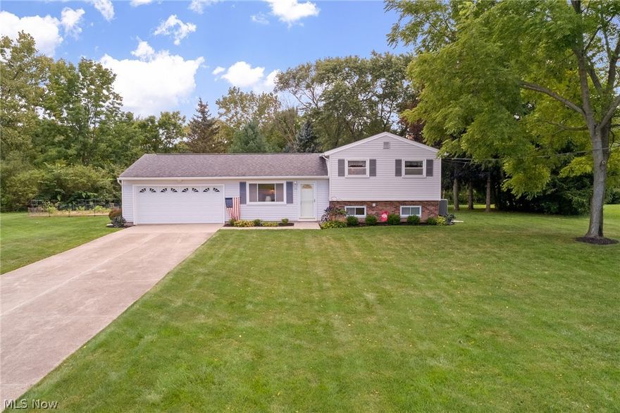 One Owner! Lovingly maintained 3BD/1.5+ split-level in a fantastic Streetsboro location! The welcoming floorplan includes an inviting living room that opens to the eat-in kitchen with newer microwave/convection oven combo (2019). Upstairs are 3 ample bedrooms with newer laminate flooring (2012) and a full bathroom with tub/shower combo. A charming family room on the lower level comes furnished with an air-tight stove that can be used to heat the entire home and also a half bath. In the adjacent laundry/utility room is a second shower that combined with the half bath provides the convenience of having a second full bath on the lower level. Enjoy the outdoors under the covered patio that overlooks the large .5+ acre yard that provides the perfect space for entertaining, gardening, or relaxing on a sunny day. 2 large sheds provide abundant storage for your yard equipment and toys. 2-car garage provides attic access for additional storage. Conveniently located near Ohio Turnpike, Rtes 480,