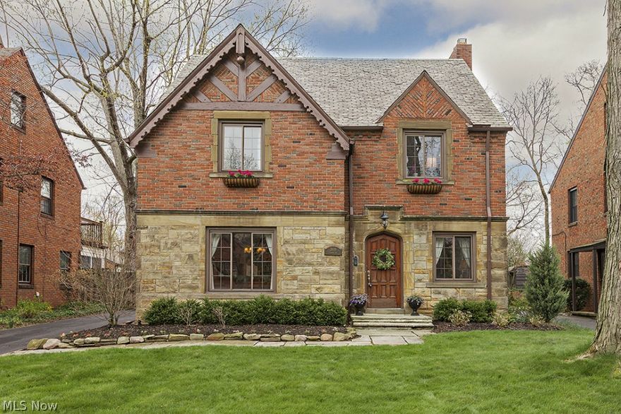 You will be captivated by this beautiful stone and brick home, located on a premiere tree lined street in University Heights. Sophisticated décor updated for today’s living; with charming architectural details, gleaming hardwood floors, and arched openings. The first floor features a sunlit living room with alcove and built-in, stunning fireplace, French doors to a 3 season room, and formal dining room. The renovated eat -in kitchen boasts stainless appliances, Amish custom cabinets, and mud room. The 2nd floor offers 3 large bedrooms including the master and an updated hall bath. The finished 3rd floor has a perfect suite with full bath. The lower level contains a finished rec room with fireplace. This home also features a gorgeous fenced yard with brick paver patio, newer mechanicals, central air, attached garage, beautiful light fixtures, and window treatments… all you have to do is move in! Close proximity to shopping, dining, freeway access, downtown, universities and hospitals.