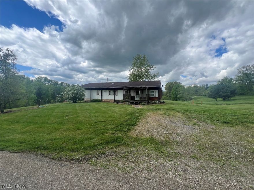 Looking for an amazing country setting? You found it! This one acre lot would be great to build your dream home. Mobile home could be renovated or removed. 2 car oversized garage with workshop has a metal roof and is full of possibilities. Septic was installed 4 years ago. Propane hook up available on property. Do not miss the opportunity to own this lovely peace of Heaven tucked away in Holmes County! Call for a showing today!!!