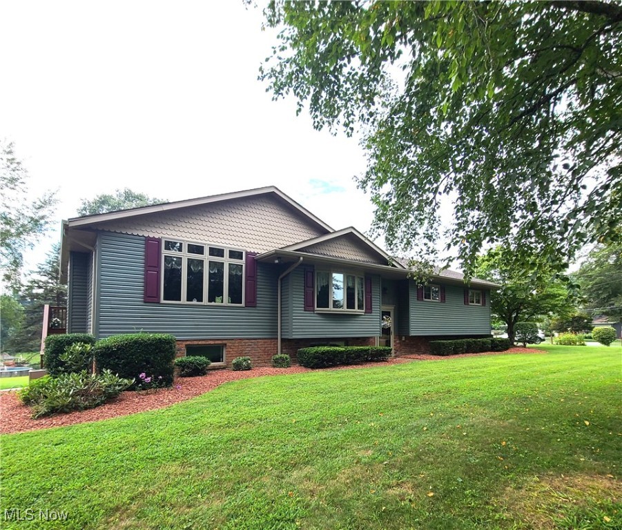 This pristine 3,100+ square foot home offers exceptional living space on a beautifully maintained 0.85-acre lot, tucked away on a quiet dead-end road. Boasting 4 spacious bedrooms and 2 full bathrooms, this home is perfect for those seeking both comfort and functionality. The kitchen is a true highlight, featuring solid surface countertops, all appliances included in the sale including a brand-new LG refrigerator, custom Shutler cabinetry, and under-cabinet lighting for a touch of elegance. A large family room provides ample space for gathering, with double doors that open onto a covered deck—perfect for enjoying the peaceful outdoor setting. The 32x24 detached three-car garage offers plenty of room for vehicles, storage, or hobbies. Every inch of this property reflects the seller's pride of ownership, making it a rare find in immaculate condition. The home is approximately 3 miles from St Clairsville and 14 miles from Wheeling WV.