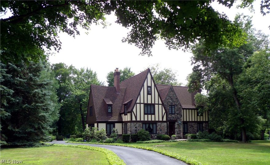 See the virtual tour! Your success will show in every room of this magnificent custom built Tudor home. Impress your guest and reward your family when you entertain in this elegant yet functional home surrounded by 4.15 scenic acres with mature trees and private serene pond. No craftsmanship detail was overlooked in this home. Built to stand for centuries. Your hard work has paid off as you reward yourself with the quality of living much sought after, rarely found and available for you here. You can't help but smile when living in your own private piece of paradise. Hard wood floors under all carpeting. Agent is related to Seller.