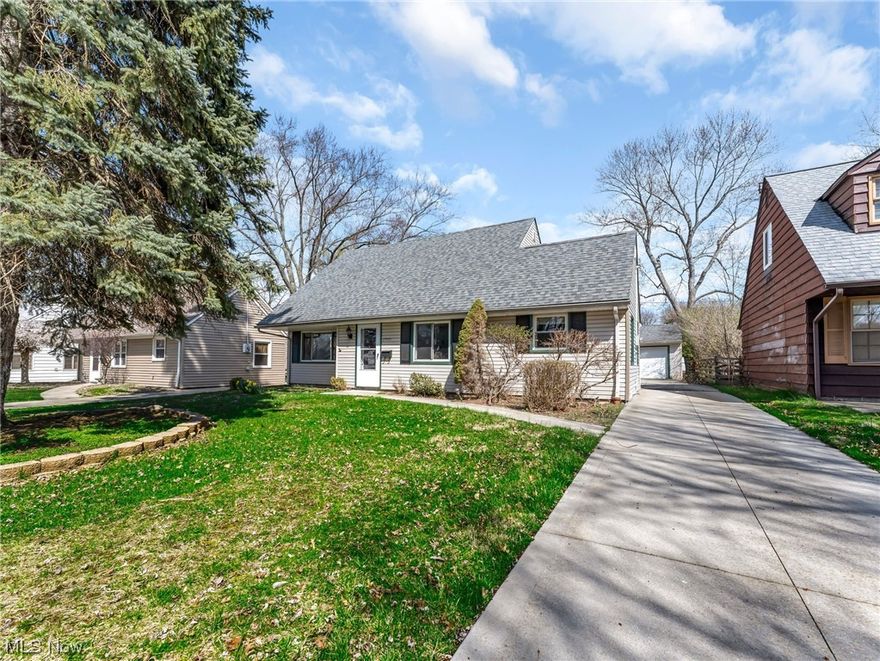 Great opportunity to own a charming Cape Cod in Euclid! This 1,434 square foot home features four bedrooms and two full bathrooms, newer windows, a fully-equipped kitchen and spacious living areas. As you enter the living room, you'll notice wood-look vinyl flooring, crisp neutral paint, and a large picture window. The living room is open to the dining room that connects to the the galley style kitchen that includes a full complement of appliances. At the back of the house are two bedrooms, including one that has been converted to a den with a built-in desk and a stone fireplace! A laundry room and a full bathroom complete the main floor. Upstairs, you'll find the primary bedroom, a fourth bedroom, and a second full bathroom. Outside, there is a two-car detached garage, a brick patio, and a fenced-in yard. This home is located close to shopping, dining, and the Cuyahoga County Airport - you won't want to miss this one!