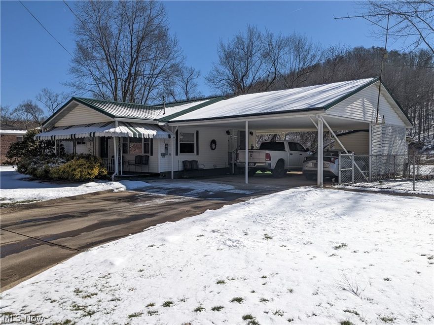 Remodeled from the studs, this house looks brand new on the inside! The living room, kitchen and dining room all wraps into one big open floor plan making it perfect for hosting guests. Sliding glass doors in the dining room lead out into the carport making it an easy walk with a handful of groceries. All on one end of the house, you will find 3 bedrooms and the guest bathroom. With no stairs, this home is perfect for one-level living. Outside, there is a large fenced area great for kids and pets to roam. Did I mention Riverfront? Bring your kayak, fishing pole and cooler and have a great float down the Little Kanawha River. Need a mother-in-law suite or guest house? The garages have an apartment perfect for the occasion! The rest of the garage has 3 stalls perfect for the car enthusiast or mechanic. Storage is not an issue on this property. Want to just purchase the house or garage? Contact the listing agent for details. 

** The owner of this property is offering a 14 month home wa