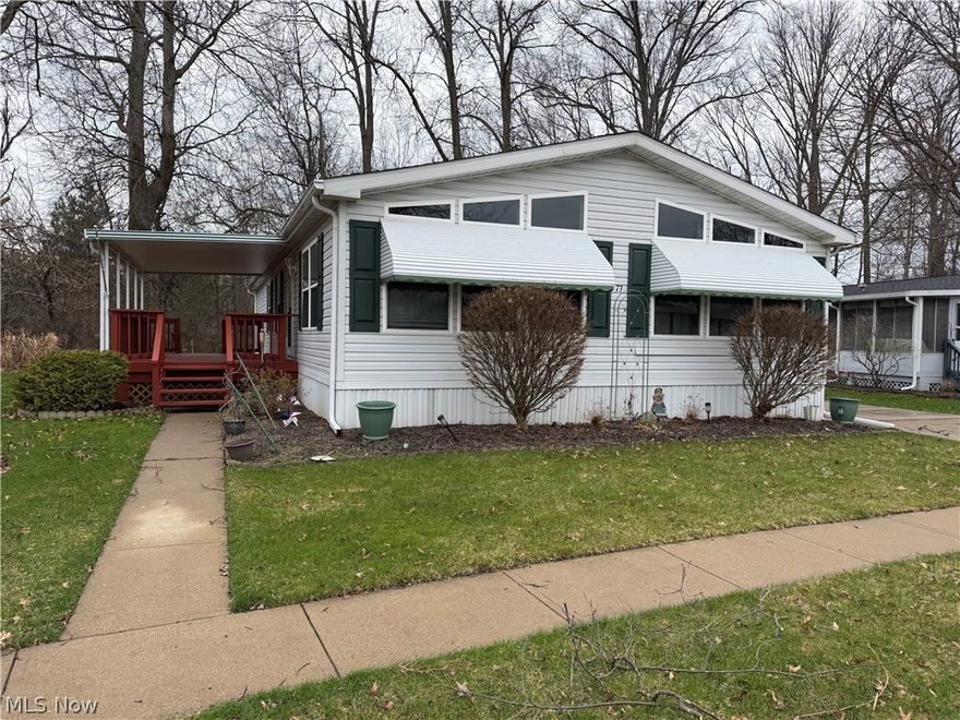 Welcome to Columbia Park 55 and older adult land-leased community! The open concept of this Woodfield double wide 56'x28' manufactured ranch home offers 1,568 sq. ft. of living space! Large living room with decorative fireplace opens to dining room area! Spacious kitchen with loads of cabinets & counterspace! The master bedroom has a spacious master bath with garden tub & shower, skylight, plus huge walk-in closet!  Two more nice size bedrooms or you can use as office or den! The second full bath also has a skylight. Separate laundry room! The HVAC system & hot water tank 2022. Roof approx. 7 yrs! Enjoy the private side porch!