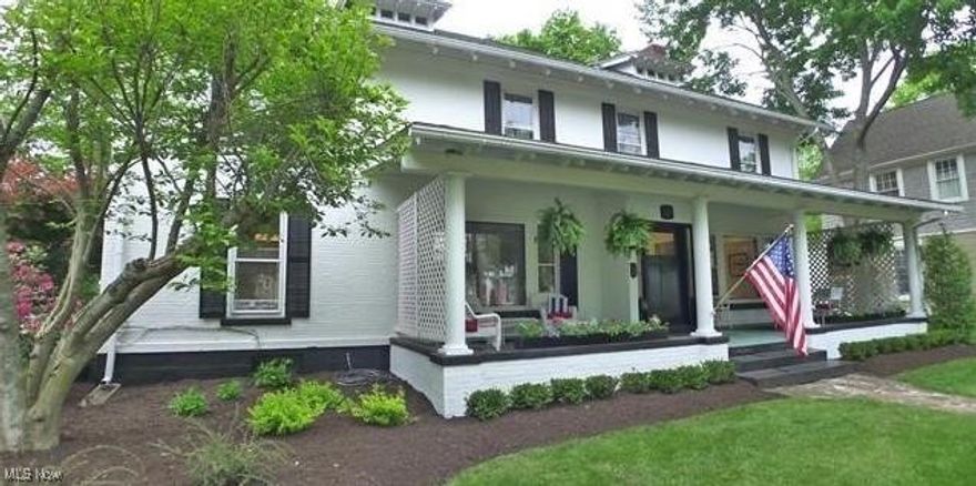 One of Chagrin Historic Districts finest! All brick painted white Federal Colonial built by William Hutchings for himself in 1860. Charming home with a large inviting front porch and unique to the Village - an expansive lot and 3 car garage. Spectacular interior highlighted by rich hardwood floors, newer white gourmet kitchen with exposed brick opening onto a fabulous glass walled hearth room with fireplace and a magnificent library with fireplace. 5 bedrooms on 2nd floor including a primary suite with sitting room and updated bathrooms. Just move into this gorgeous home and enjoy.