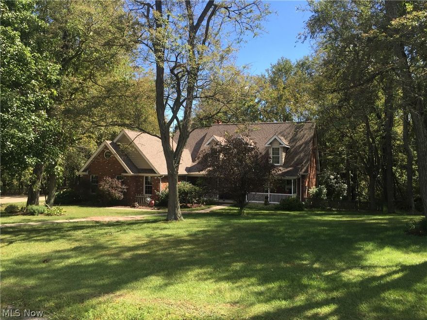 Beautiful 1.5 story Brick home at the end of a cul de sac on 7.5 acres.  Custom home features beautiful landscaping with invisible pet fencing (includes 4 dog collars), circular driveway, amish built barn and shed.  It's even more beautiful on the inside!  Hardwood floors throughout most of the first floor and a cozy woodburning fireplace in the living room for those cold winter nights.  Eat in Kitchen features stainless appliances, duel fuel cooktop range and custom oak cabinetry.  First floor master suite features hardwood floors and walk in closet.  Basement features a wet bar and a woodburning fireplace with french doors leading to the covered patio and hot tub.  Mineral Rights are leased and expires in 2017.  Mineral rights are not being conveyed but are negotiable.  Amish built barn has a 2nd story which could be easily be converted to additional living space.