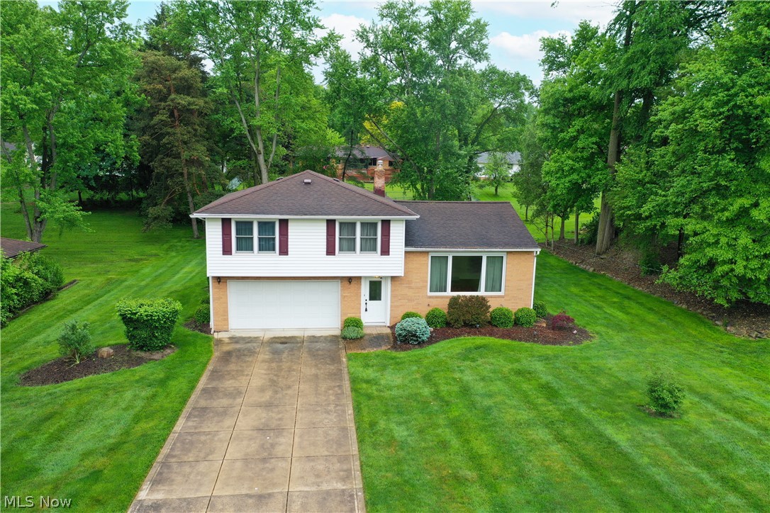 Move right in to this beautiful three bedroom 1 1/2 bath split. Enter into a foyer with ceramic tile which leads to the mud room and half bath. Walk up a few steps to a large living room with beautiful hardwood floors and large picture window. All applianced white kitchen with vinyl flooring and large eating area. Off the kitchen is a large deck leading to a beautiful private back yard. Three large bedrooms with hardwood floors make up the upper level. One bedroom features built in bookshelves. Full bathroom on the upper level. Off the foyer is a lower level family room with carpeting as well as a separate area for laundry and folding station. Make your appointment today. Some rooms virtually staged.