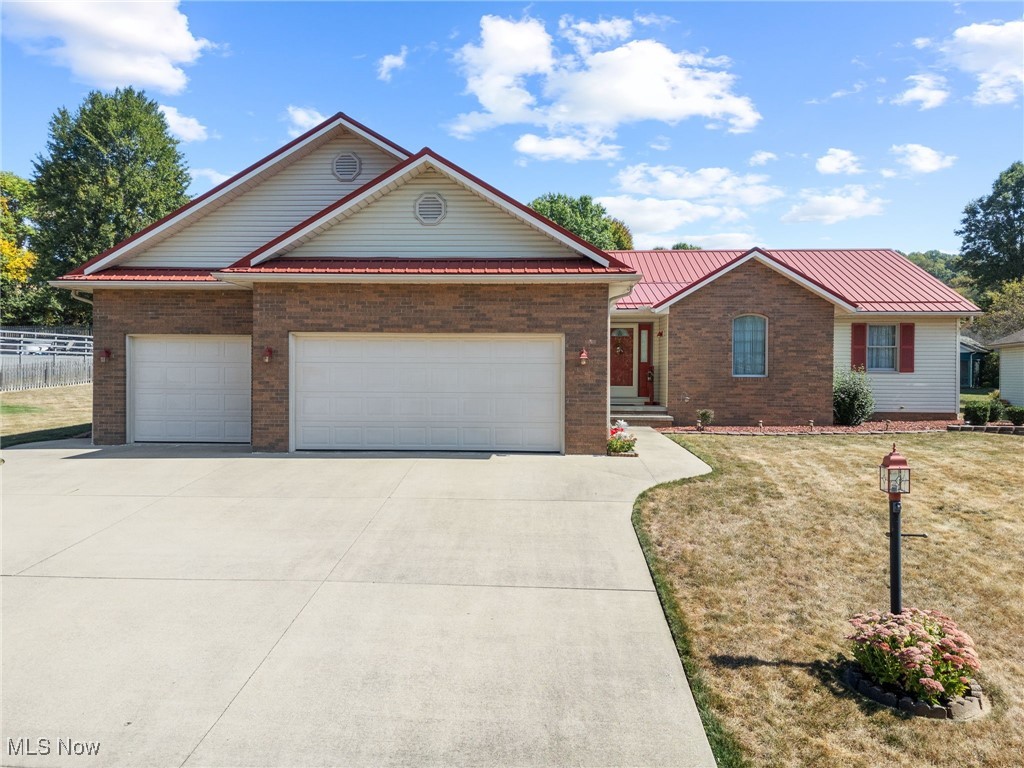 For the very first time, an extraordinary one-owner home in Schoenbrunn Estates is available - a showcase of Amish craftsmanship, thoughtful design, and timeless quality. Spanning 3,724 +/- sq. ft. of finished/unfinished space with 3 bedrooms, 3.5 baths, and a seamless first-floor layout, this home blends everyday comfort with remarkable detail. Wide hallways, 3-ft doorways, and solid oak finishes reflect both accessibility and enduring style. Step inside to vaulted ceilings and a living room anchored by a warm gas fireplace with custom built ins. Just beyond, an all-season sunroom offers panoramic views of the backyard, filling the home with natural light. The kitchen is complete with a full appliance package, deep cupboards, and a generous pantry, while a nearby laundry and half bath add convenience. The private suite offers a skylit bathroom retreat, while French doors open to a versatile office or guest space. The finished lower level, built with a 12-course block foundation, expands the living area with a spacious rec room, kitchenette, full bath, walk-in closet, and garage walk-up access, offering the versatility to create a 4th bedroom or an apartment-style suite. Mechanical upgrades include a Rheem water heater (2023), NEW Rheem furnace and A/C unit (2025), sump pump with backup, reverse osmosis system, and a central vacuum system. An oversized three-stall garage provides a workbench, ample cabinet space, heater, ceiling fan, hot/cold water, and additional central vac hook-up. Outside, .45 +/- acres across two parcels offer a cement patio, shed with electric, and a terraced brick paver retreat with accent pillars - ideal for cookouts, fire pit nights, or quiet evenings surrounded by soft light. Set among friendly neighbors in one of New Philadelphia’s most desirable communities, this Schoenbrunn Estates property is more than a home - it’s a rare opportunity to live with comfort, quality, and distinction. Don’t miss the chance to tour this one-of-a-kind home!