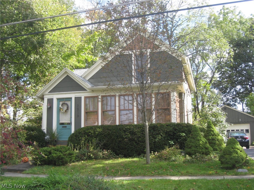 Charming and cozy Century home nestled on large landscaped lot. The deck and patio overlook the private fenced park like yard with perennial gardens. As you step in, the inviting front porch welcomes you, perfect for morning coffee and afternoon tea as you watch the world go by. The warmth enfolds you as you are surrounding by century old arched doorways, stair case, the wide moldings and beautiful wood floors that compliment each room of the home. Plenty of light filters through the long windows in the living and dining rooms. The kitchen offers all appliances, a built in hutch and a deep farm size sink. The half bath finishes the main floor. Upstairs you will find the bedrooms and full bath. The basement has been waterproofed by Ohio State Waterproofing 2009, glass block windows 2004, rubber roof on porch 2009, exterior paint 2013, bath faucet 2018, half bath commode 2009 and garage door opener 2015. Walk to schools, shopping, the newly renovated downtown area, the library, the YM