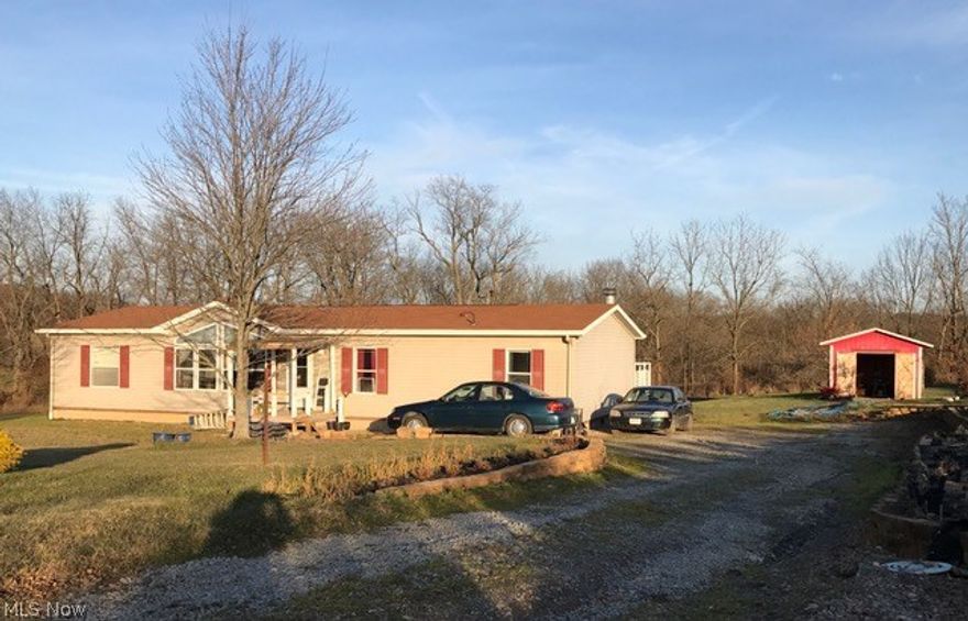 Modular per auditors office. Raised garden beds. 28 x 10 rear covered deck. Retaining wall right perimeter. Storage building 12 x 16. 2002 wood burning fireplace in the family room. Homestead tax savings $332.30.