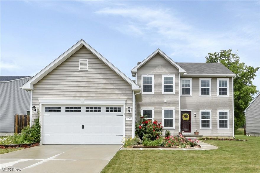 Prepare to be Moved!! And welcomed by your dream home! Why wait to build when you can own this nearly new Colonial-style home situated in the desirable neighborhood of Waterbury, North Ridgeville, giving you the best of both city amenities with a country feel. With 3 bedrooms, 2.5 bathrooms, and 2-car attached garage, this home is perfect for your family. Upon entering, you'll be welcomed by a foyer, office/living room with doors for added privacy, and a primary suite located on the main floor. The open kitchen and morning room with large center island provides extra seating as well as a pantry. Natural light pours into the family room with vaulted ceilings and a fireplace, providing a cozy atmosphere. Just off the garage is a mud room with customized cabinets for convenience, not to mention the first floor laundry and half bath that complete the main level. The second floor features two bedrooms and a full bath. Huge unfinished basement can easily be converted for extra livable square