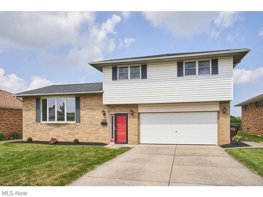 Welcome home to this nicely updated split-level situated in the heart of Parma conveniently located near shopping, dining, community parks and transportation!  Living room features hardwood floors and bay window bringing in a natural light through the second level! Kitchen has new granite counter tops, back splash and stainless steel appliances! Dining area has hardwood floors and sliding doors the the back yard deck and patio! The third level includes a full bathroom and 3 bedrooms all generously sized! The first level includes a full bathroom, foyer and access to the two car garage! The lower level includes a finished recreation room along with utility room with laundry area a shower! Updates: Carpet, kitchen counters & backsplash, painting, tankless hot water tank and Nest thermostat! This home has an open and airy floor plan and is a great place to make lasting memories!