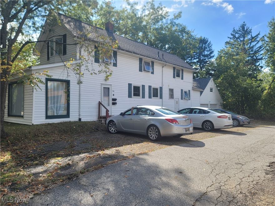 DUPLEX HOME THATS SHOWS IN THE COUNTY AS A 3 FAMILY.  KENT WILL ONLY ALLOW 2 WITH THE CURRENT PARKING ETC  iT MAY BE POSSIBLE TO MAKE A 3 FAMILY, BUT CURRENT OWNER IS OK WITH IT BEING A 2 FAMILY.  THEIR IS FRONT PICTURE WINDOW WHICH FACES THE MAIN ROAD & YOU MAY BE ABLE TO USE THE FIRST LEVEL AS A COMMERCIAL BUSINESS.  YOU NEED TO CK ZONING.  THE HOME IS RENTED FOR THE CURRENT YEAR TO STUDENTS AT KSU.   THERE IS ROOM IN THE UPPER PART OF THE GARAGE FOR AN ENTERTAINMENT AREA OR JUST STORAGE.  2 CAR PARKING GARAGE AS WELL AS MANY SPACES AROUND THE PROPERTY.