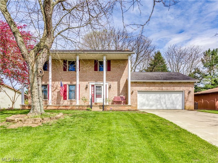 If you are looking for a southern stately feel, this home with white pillars across the front is for you! Walk into the large foyer that leads to the formal living to the left. This large space ties right into the dining room with chandelier. The kitchen is situated in the middle of the home. Granite countertops and tile backsplash. Relax in the family room with accent wood beams and gas fireplace with brick surround and wood mantle. Off the family room is a 3 season room with windows surround and access to the pretty wrought iron fenced in backyard. Head upstairs to the master suite. Large and spacious with double door closet. The master bath has a granite top vanity, tile backsplash and walk in shower. The three additionals bedrooms are all a very nice size with large closets. The second full bath has a shower/tub combo, granite top vanity and tile backsplash. A nice added touch to this home is the crown molding that runs through some of the rooms. This home is walking distance to a