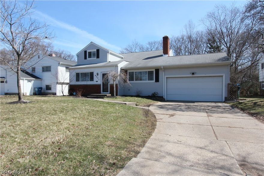 Turn your Dreams to Reality with this fully renovated split-level home!  Refinished Hardwood floors throughout main level and all 3 spacious bedrooms. Two full bathrooms and laundry room have been updated with heated floors and timeless tile. Large open kitchen did not leave out any details! Heated floors, granite countertops, and all new stainless steel appliances, including beverage cooler! Kitchen opens to dining and living space with cozy wood burning fireplace, large windows with plenty of natural light, and lofted ceilings.  Lower level includes additional carpeted living space with sizeable windows and access to garage and fully fenced in backyard.  Back yard includes natural gas hook up for your grill, large deck with bar top built in. Attached two-car garage has added loft storage. This home also has brand new energy efficient HVAC system including whole house humidifier installed March 2017. Blown in insulation added in 2013 and all-new Universal Windows, with double lifetime