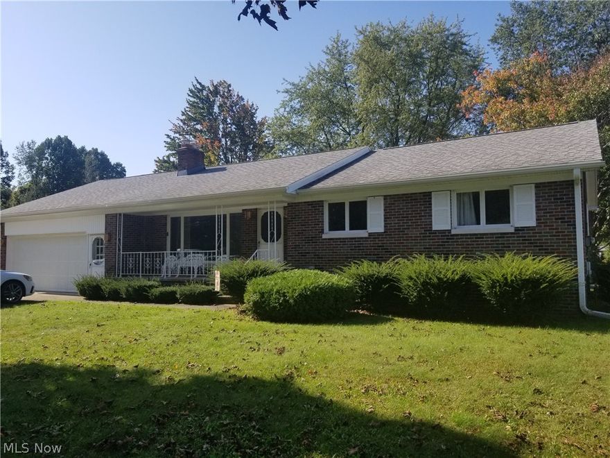 Beautiful brick ranch in highly sought after neighborhood! Home situated on 2 lots of over .5 acres, paved driveway, large 2 car attached garage with work area, shed/outbuilding with overhead door and 2 covered porches with natural gas hook up for your grill. 
The interior of the house has original oak wood floors, stone fireplace, large master bedroom with his and hers closets. Kitchen is open to a breakfast area and formal dining room. Partially finished basement has a canning kitchen, utility room, large rec room and full bathroom.  
Many upgrades: Roof 2013, Boiler 2013, A/C 2014, Garage Door 2015, Hot water tank 2016.