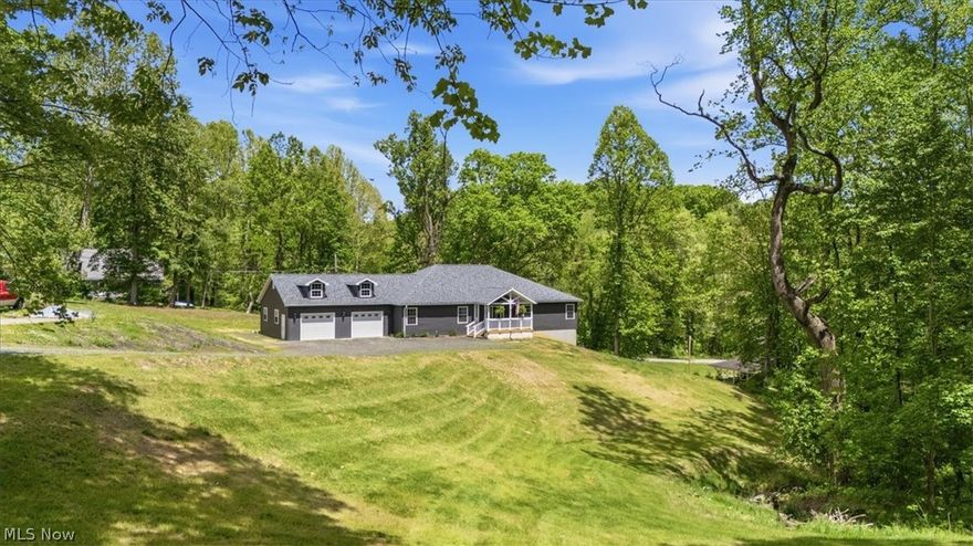 Welcome to your own private retreat! Built in 2024, this stunning home offers the perfect blend of modern finishes, open-concept living and peaceful country surroundings on 1.6 acres. Vaulted ceilings, luxury vinyl flooring and an oversized great room perfect for gatherings and entertaining! The beautiful kitchen is the heart of the home with crisp white cabinetry, granite countertops, large island with seating, luxury appliances and plenty of storage. The open living space flows perfectly to the covered back deck where you can relax and enjoy the country setting. The primary suite offers a spa-like retreat within the bathroom, two closets and has direct access to the back deck. You will have plenty of extra space with the 2-3 additional bedrooms, office and two more spa-like bathrooms. Downstairs is a blank canvas, ready for you to finish in whatever way suits you best, but the focal point with gas fireplace is already framed in, and there's plumbing available for an additional bathroom to be added. Outside, enjoy the charm of the inviting front porch, oversized 2-stall attached drive through garage and an additional garage built into the basement. This property is truly remarkable, and even better in person! Schedule your tour today.