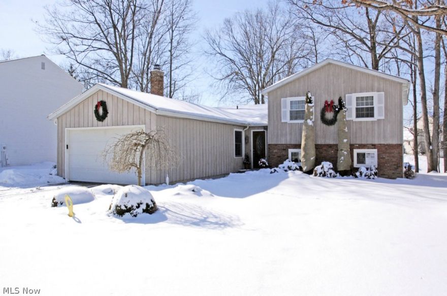 Magnificent...remarkable...breathtaking...this one of a kind, custom home will appeal to the most discerning of buyers. The moment you step through the custom, leaded glass, front door you will be absolutely astounded by the natural hardwood flooring and wide open, modern floor plan. The large open kitchen with stainless steel refrigerator, range and microwave - provides plenty of room for the chef in the family to cook their favorite recipes while engaging in casual conversations to the open family room; with family and friends. Here you will find amenities like no other, including wood burning masonry front fireplace with upgraded cast iron doors. Just a short stroll upstairs leads to the sumptuous owners' retreat boasting a large walk-in closet. Upstairs there is also a fully remodeled full bathroom with amble space for everyone. Lower level features HUGE rec room for anything you can imagine plus a large private office. Outside, peace and tranquility await you on the large custom d